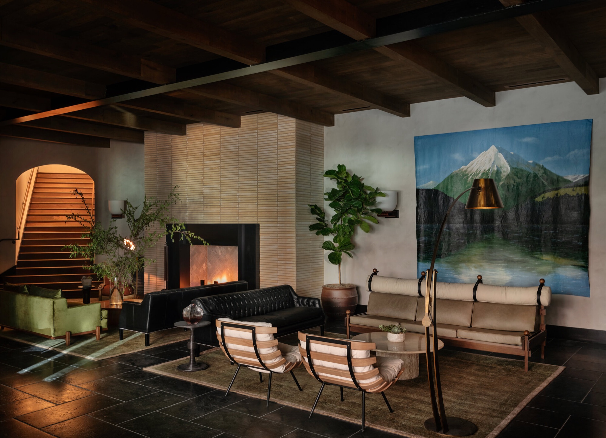 The Forth club lounge with fireplace, leather sofa, and warm timber ceiling