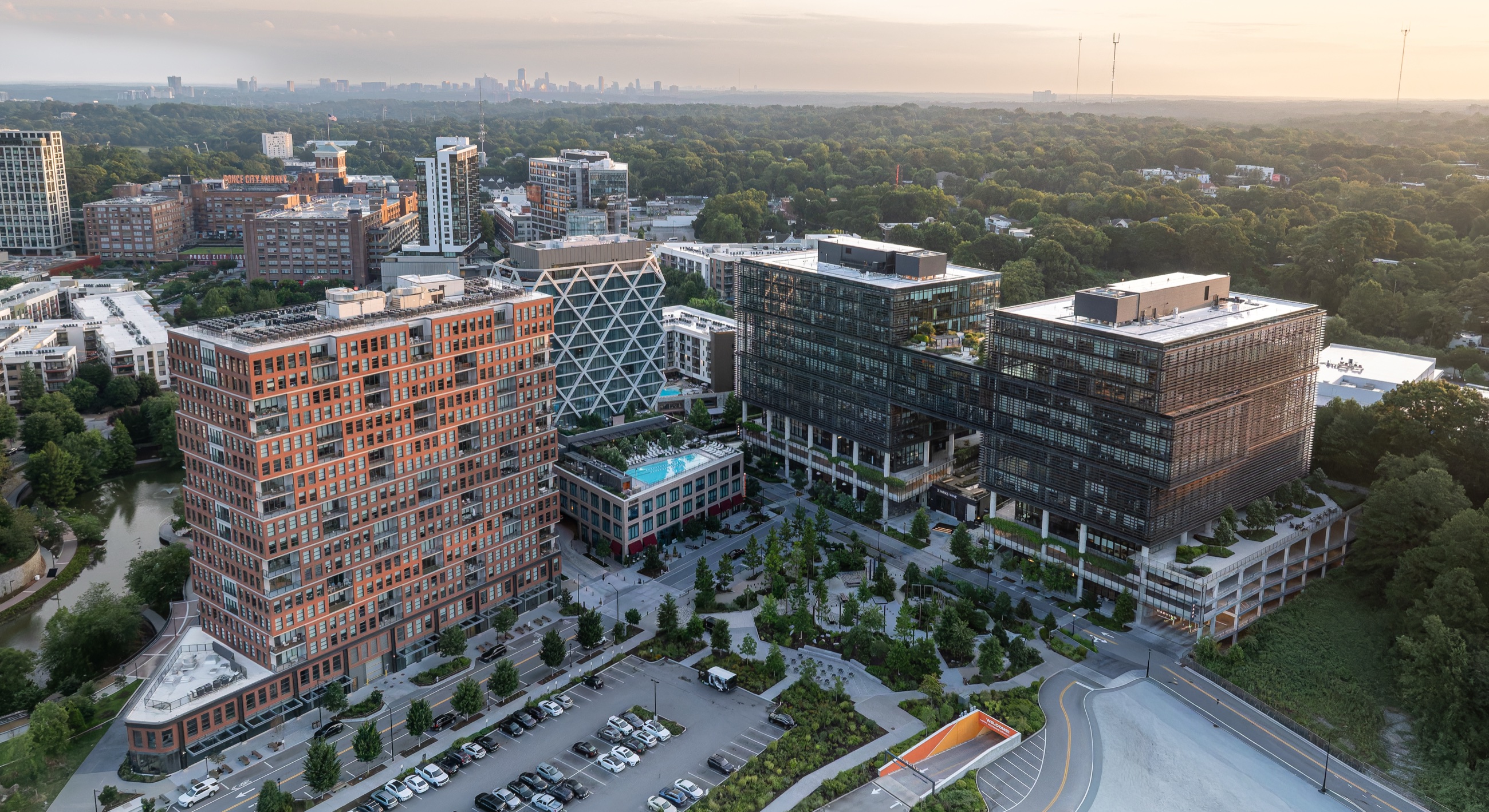 Aerial of Fourth Ward at golden hour with the Atlanta skyline beyond, on the BeltLine by Ponce City Market